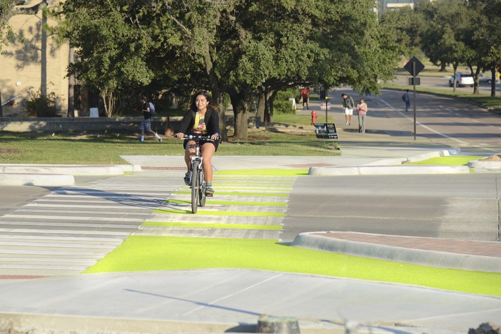 A student rides the Dutch-style protected junction