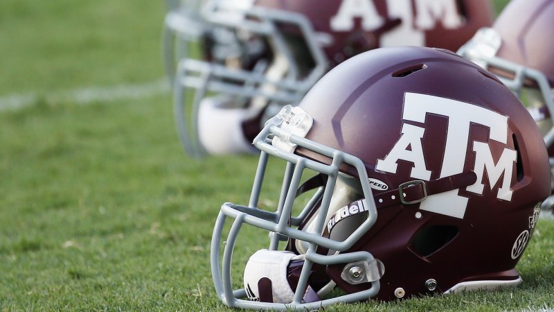 An Aggie football helmet sits on the turf of Kyle Field